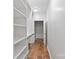 Bright closet space with built-in shelving and wood floor at 505 Kemp Rd, Mooresville, NC 28117