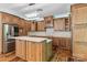 Beautiful kitchen with wooden cabinets, quartz countertops and stainless steel refrigerator at 505 Kemp Rd, Mooresville, NC 28117
