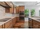 Kitchen with oven, countertop, wooden cabinets, and large stainless steel appliances at 505 Kemp Rd, Mooresville, NC 28117