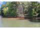 Tranquil view of the lake with mature trees at 505 Kemp Rd, Mooresville, NC 28117