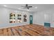 Bright living room featuring hardwood floors, natural light, and a green front door at 505 Kemp Rd, Mooresville, NC 28117