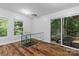 Bright stairwell with hardwood floors and views of the outdoors at 505 Kemp Rd, Mooresville, NC 28117