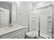 Clean bathroom featuring a vanity with a white countertop and a glass-enclosed shower at 5103 Heathland Dr # 50, Charlotte, NC 28215