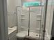 Modern bathroom with a glass-enclosed shower, white cabinetry, and neutral tones at 5103 Heathland Dr # 50, Charlotte, NC 28215