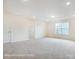 A large room featuring carpet, recessed lights, and a walk in closet at 5103 Heathland Dr # 50, Charlotte, NC 28215