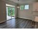 Bright breakfast nook featuring sliding glass doors, white cabinetry, and hardwood floors at 5103 Heathland Dr # 50, Charlotte, NC 28215