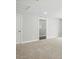 Upstairs hallway featuring new carpeting and doors leading to the various rooms of the house at 5103 Heathland Dr # 50, Charlotte, NC 28215