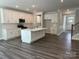 Gourmet kitchen with an island, stainless steel appliances, and sleek white cabinets at 5103 Heathland Dr # 50, Charlotte, NC 28215