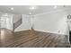Spacious living room with wood floors, fireplace, and bright natural light at 5103 Heathland Dr # 50, Charlotte, NC 28215