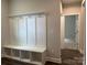 Hallway with mud room drop zone, bench seat, and ample storage space at 5103 Heathland Dr # 50, Charlotte, NC 28215
