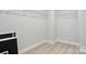 Walk-in closet with white shelving, carpeted floor, and ample storage space at 5103 Heathland Dr # 50, Charlotte, NC 28215