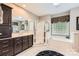 Bathroom featuring tub, separate shower, tiled floor and dark cabinetry at 534 Ballymote Ct, Matthews, NC 28104