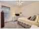 Cozy bedroom with carpet, window and white dresser with tv at 534 Ballymote Ct, Matthews, NC 28104