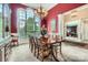 Formal dining room with large windows, chandelier, and elegant decor at 534 Ballymote Ct, Matthews, NC 28104