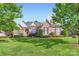 Beautiful brick home boasts lush lawn, manicured landscaping and mature trees at 534 Ballymote Ct, Matthews, NC 28104