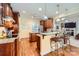 Stylish kitchen featuring wood floors, granite countertops, and modern appliances at 534 Ballymote Ct, Matthews, NC 28104