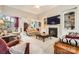 Inviting living room featuring fireplace, built-in shelving, and open layout at 534 Ballymote Ct, Matthews, NC 28104