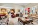 Open-concept living area with hardwood floors and views into kitchen and dining room at 534 Ballymote Ct, Matthews, NC 28104