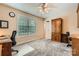 Office space with large window, desk, and carpeted floor at 534 Ballymote Ct, Matthews, NC 28104