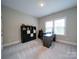 Bedroom with large window and neutral carpet at 6004 Quintessa Dr, Matthews, NC 28104