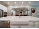 Bright, open kitchen with stainless appliances and white cabinets at 6004 Quintessa Dr, Matthews, NC 28104