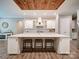Beautiful white kitchen featuring bar stool seating, island, and stainless steel appliances at 6004 Quintessa Dr, Matthews, NC 28104