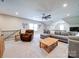 Spacious living room features plush seating, a ceiling fan, and plenty of natural light at 6004 Quintessa Dr, Matthews, NC 28104