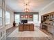 Spacious office with wood desk, hardwood floors, and natural light at 6004 Quintessa Dr, Matthews, NC 28104