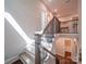 Beautiful staircase with wood treads, wrought iron railings, and natural light flooding in from above at 6004 Quintessa Dr, Matthews, NC 28104