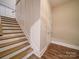 The home features an entry staircase with wooden steps and white trim at 6004 Quintessa Dr, Matthews, NC 28104