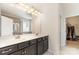 This bathroom has a double sink vanity, and a shower behind a glass door at 7113 Meridale Forest Dr, Charlotte, NC 28269