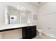 This bathroom has a toilet, a long sink vanity with a white counter, and a shower at 7113 Meridale Forest Dr, Charlotte, NC 28269