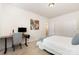 This bedroom has a desk with a computer, a bed, and a painting on the wall at 7113 Meridale Forest Dr, Charlotte, NC 28269