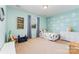 This bedroom features light blue walls, a bed, and a dresser at 7113 Meridale Forest Dr, Charlotte, NC 28269