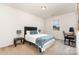 This bedroom features a queen bed and a desk with computer at 7113 Meridale Forest Dr, Charlotte, NC 28269