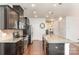 Well-equipped kitchen with a large island, stainless steel appliances, and ample cabinet space at 7113 Meridale Forest Dr, Charlotte, NC 28269