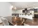 Open floorplan featuring an eat in kitchen, island, stainless appliances and view to living room at 7113 Meridale Forest Dr, Charlotte, NC 28269