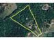 Aerial view highlighting the property boundaries, surrounding forest, and scattered homes nearby at 720 Cricket Ln, Mt Ulla, NC 28125