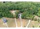 Stunning aerial view of the property surrounded by lush greenery, showcasing its spacious layout and privacy at 720 Cricket Ln, Mt Ulla, NC 28125