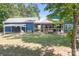 Expansive backyard with a covered patio, additional covered area, and ample green space at 720 Cricket Ln, Mt Ulla, NC 28125