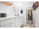 Bright bathroom with a modern vanity, a walk-in closet, and ample storage space at 720 Cricket Ln, Mt Ulla, NC 28125