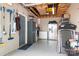 A garage interior with household appliances, storage solutions and a grey epoxy floor at 720 Cricket Ln, Mt Ulla, NC 28125