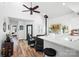 Bright living room open to the kitchen, featuring sleek furnishings, and a modern design at 720 Cricket Ln, Mt Ulla, NC 28125