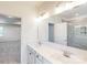 Bathroom featuring a double vanity with modern fixtures, large mirror, and an adjacent shower at 8286 Ashvale Nw St, Concord, NC 28027