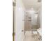 Bathroom with glass enclosed shower and tile surround at 8286 Ashvale Nw St, Concord, NC 28027