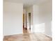 Empty bedroom features bright neutral paint and wood-look floors at 8286 Ashvale Nw St, Concord, NC 28027