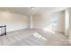 Upstairs bonus room with lots of space for entertaining and comfortable carpet at 8286 Ashvale Nw St, Concord, NC 28027