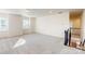 Bright bonus room with neutral carpet, ample lighting, and a view of the staircase landing at 8286 Ashvale Nw St, Concord, NC 28027