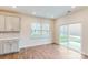 Bright dining area features wood floors, sliding glass doors, and plenty of natural light at 8286 Ashvale Nw St, Concord, NC 28027