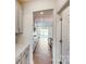 Galley kitchen with stainless steel appliances, light gray cabinets, and an attached eating area at 8286 Ashvale Nw St, Concord, NC 28027